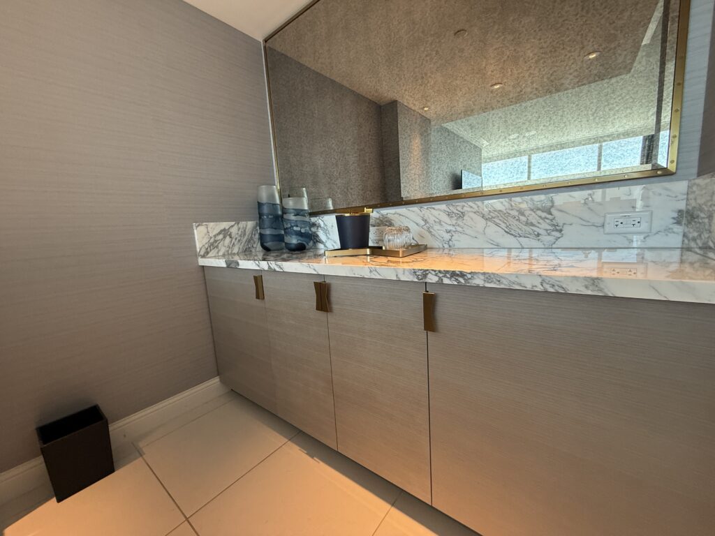 A counter on the backside of the mini bar with additional cabinet space. 