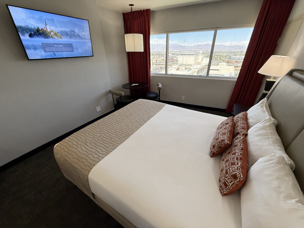 An angle of the bed, that shows it pointed at the wall-mounted 50" TV.