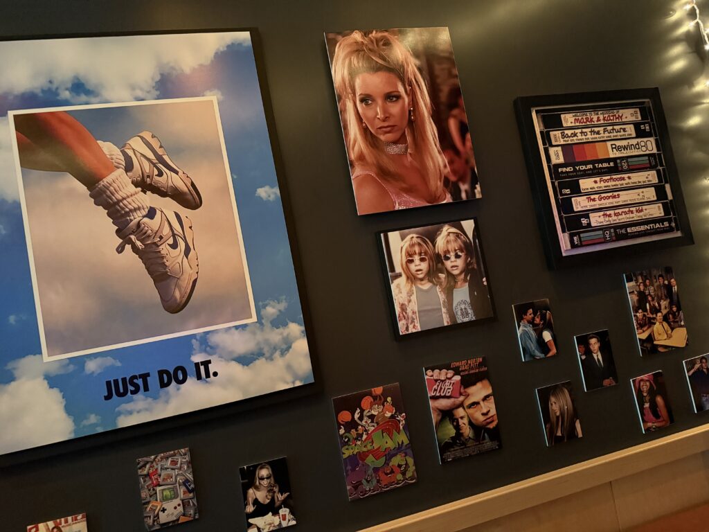More wall art, with a Nike "Just Do It" ad prominently in frame. 