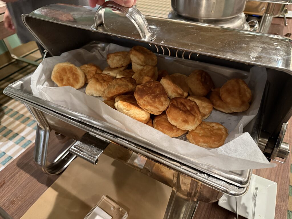 A warming tray piled high with biscuits. 