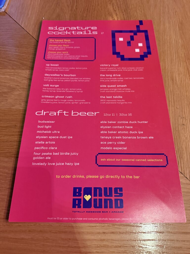 A picture of Bonus Round's drink menu, which pegs cocktails at $17 and a 32oz draft beer at $16. 