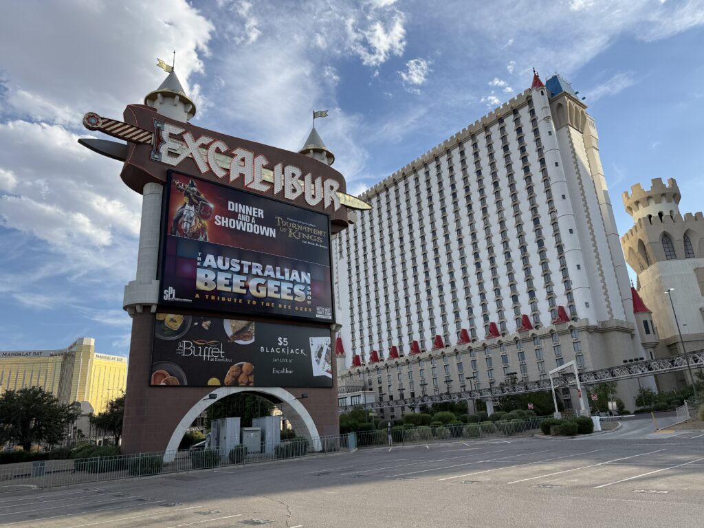 Excalibur's sign during the day, with the hotel tower in the background.