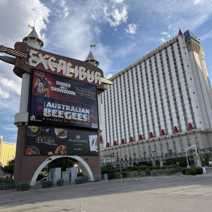 Excalibur's sign during the day, with the hotel tower in the background.