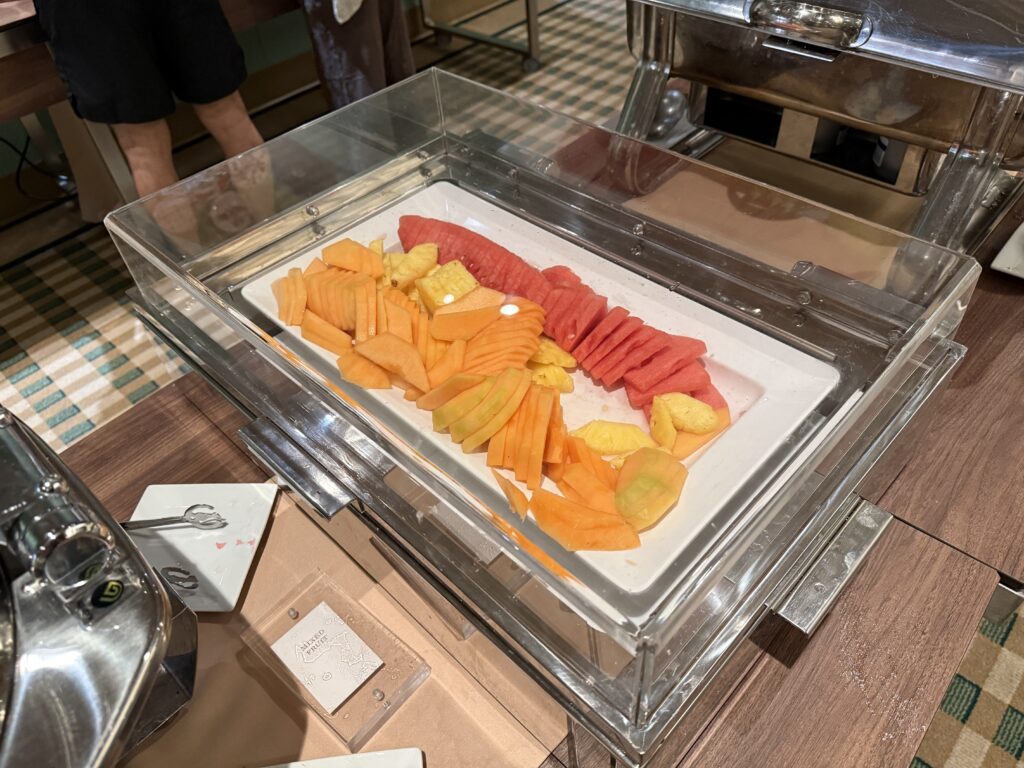 Fresh watermelon, honeydew, and pineaplle on a plate. 