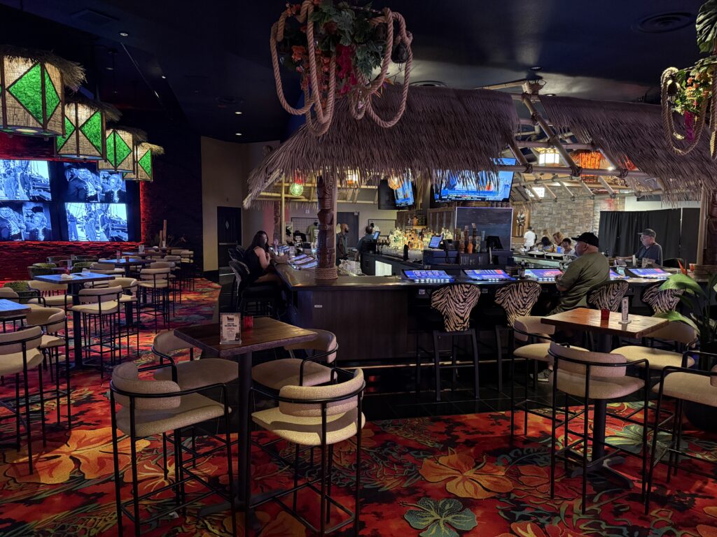 The bar within the Tiki Bar, which is dark and has a tropical vibe. 