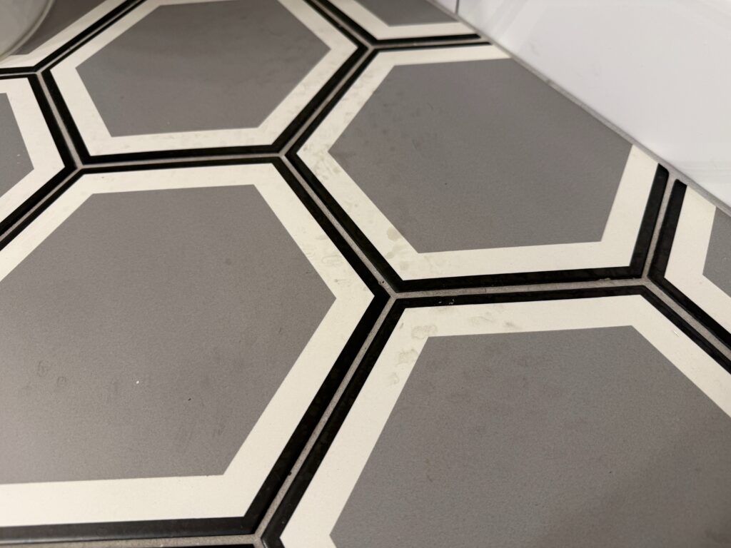More footprints on the bathroom floor.