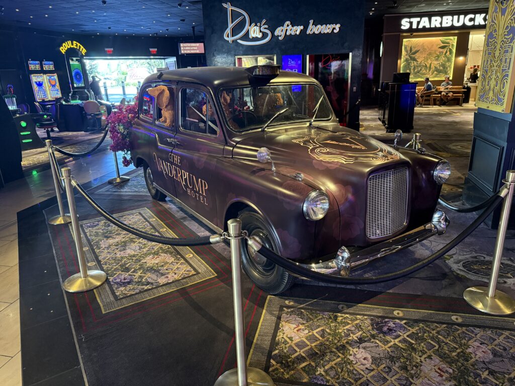 A historic car that says "Vanderpump" on the side.