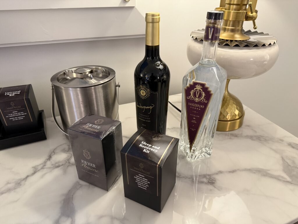 Bottle of vodka and wine on the mini-bar. 
