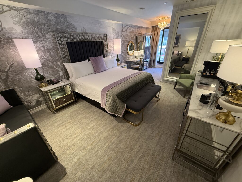A wide angle view of my room, with the king bed against an accent wall. 