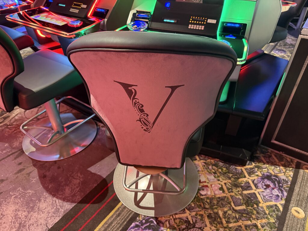 A slot chair with a "V" on it.