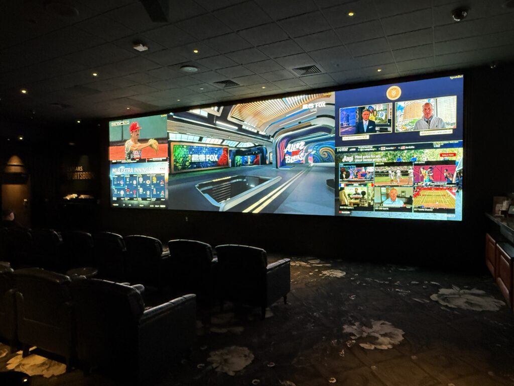 The sportsbook at Vanderpump, which has a big screen and about 20 chairs.