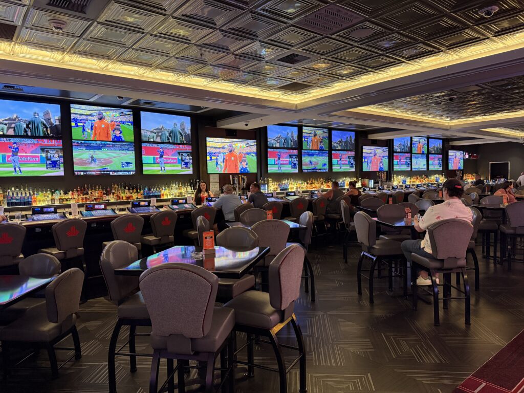 Bar CANADA at The D, with screens on the back wall playing sports.