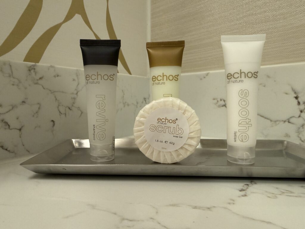 Bath products on a silver tray from the brand "Echoes of Nature". 
