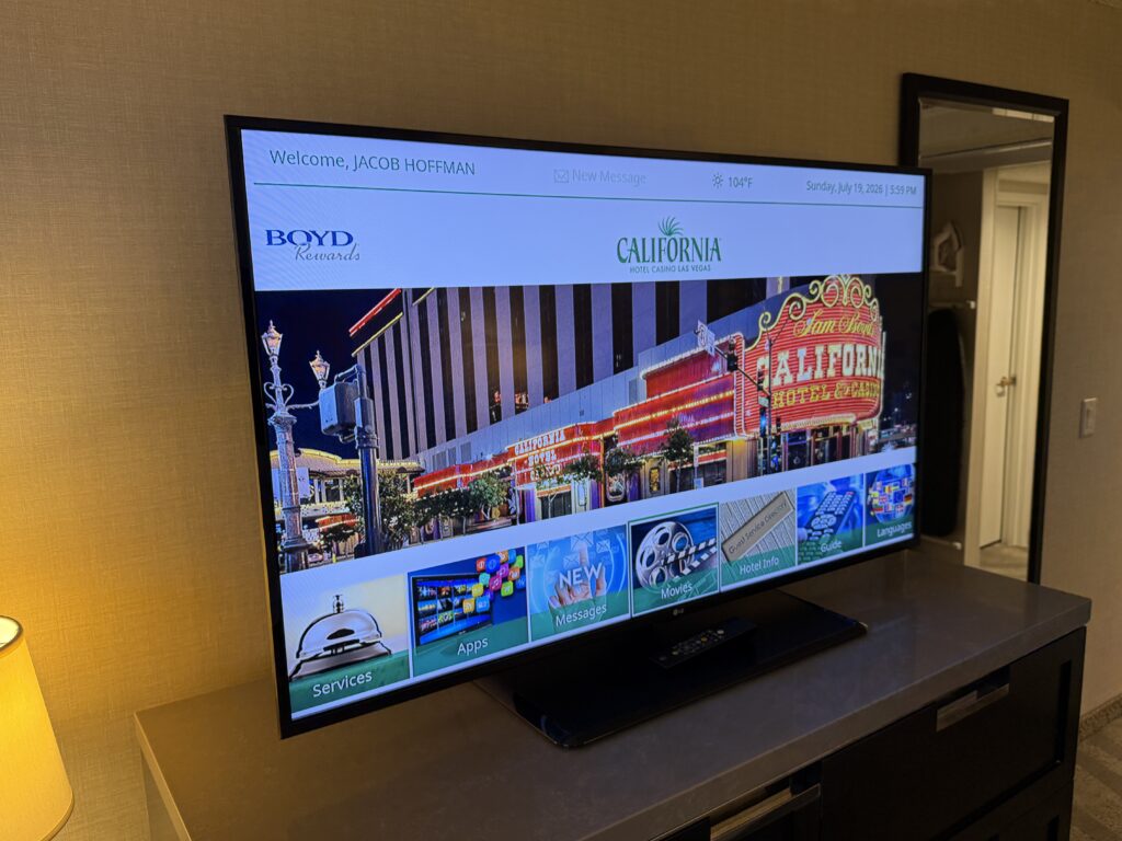 A large TV showing resort themed programming. 