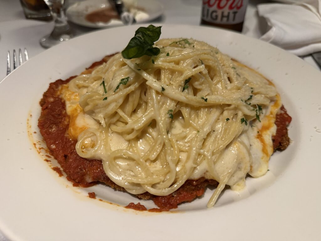 Plate of Chicken Parmesean on a table. 