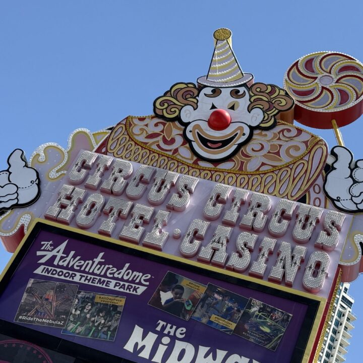 Circus Circus' neon sign during the day, which is modeled to look like a clown.