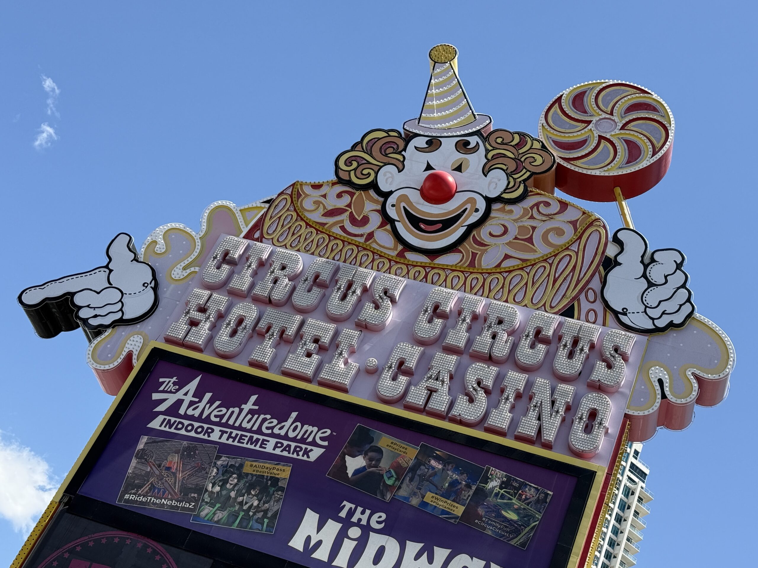 Circus Circus' neon sign during the day, which is modeled to look like a clown.