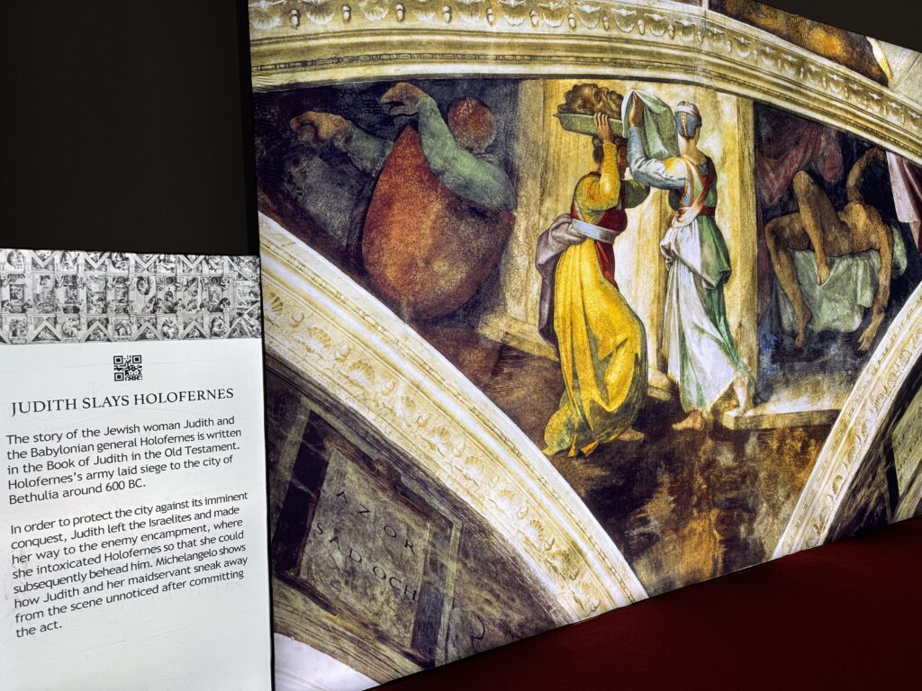 One of Michelangelo's frescoes next to a description. 
