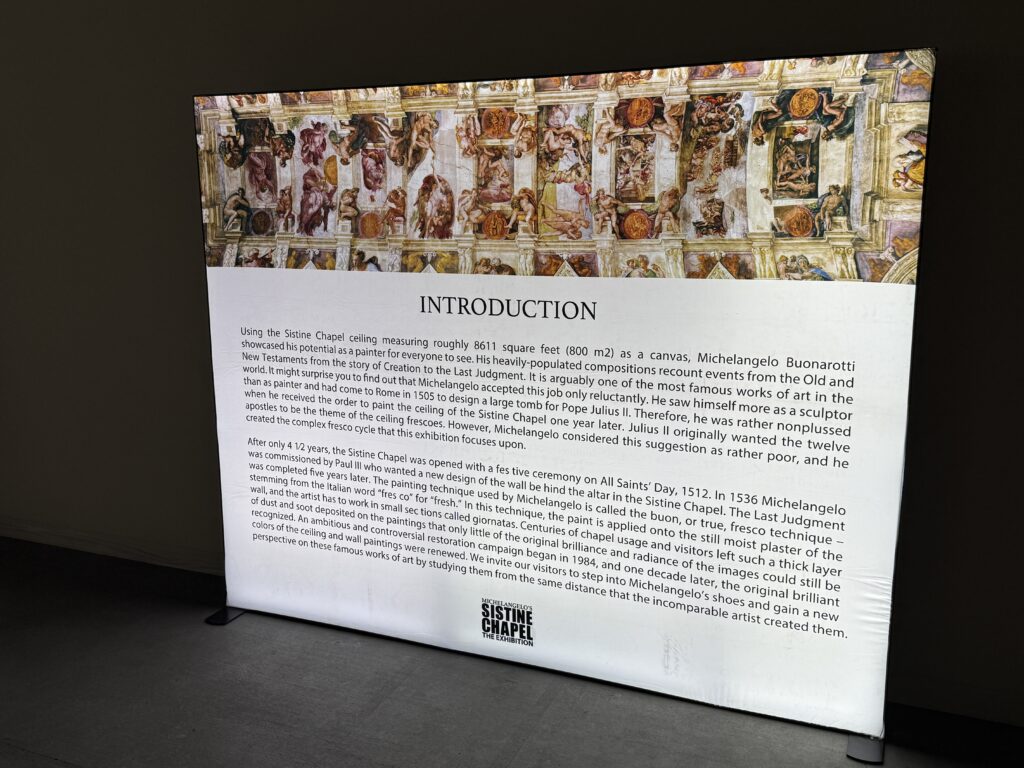 A large, illuminated placard that introduces you to the attraction with background info about the Sistine Chapel. 