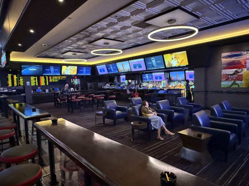 A small sportsbook with cushy seats. 