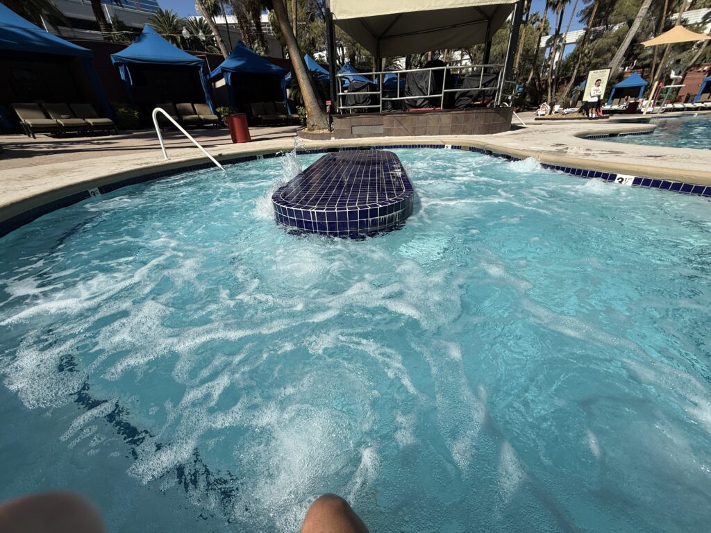 An empty hot tub with the jets on.