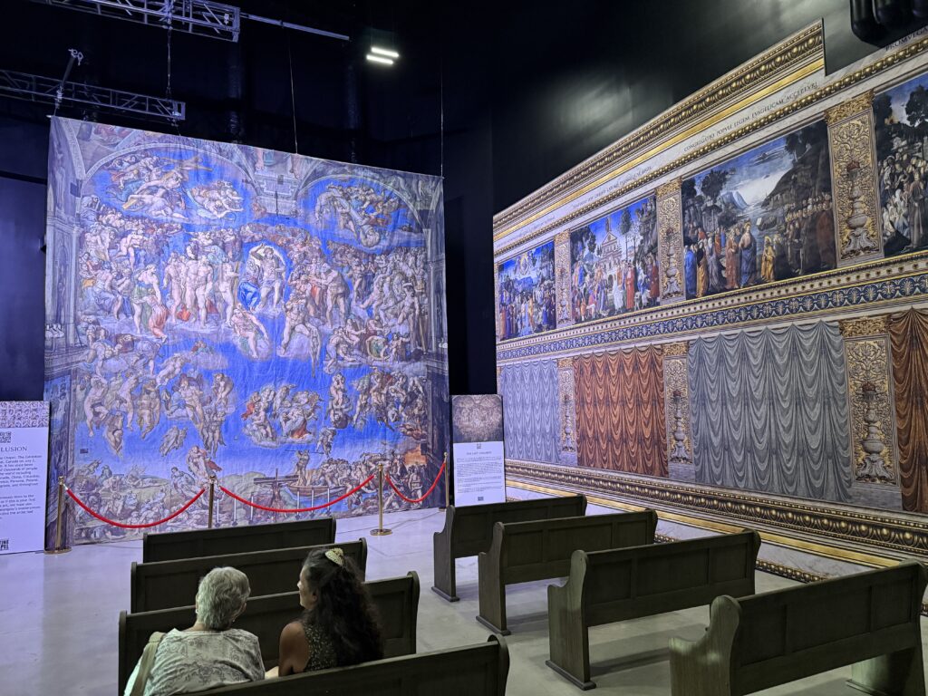 The Last Judgment fresco with pew seating pointing at it. 