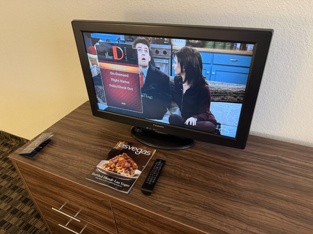 A small 32" TV sitting atop a dresser.