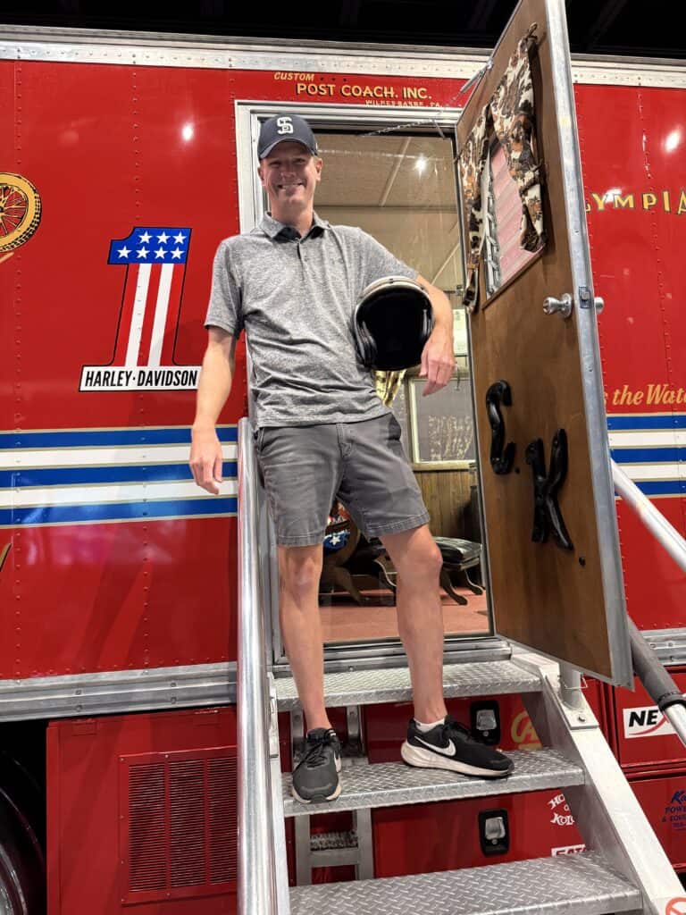 Me, in the same pose, standing in the doorway of Big Red.