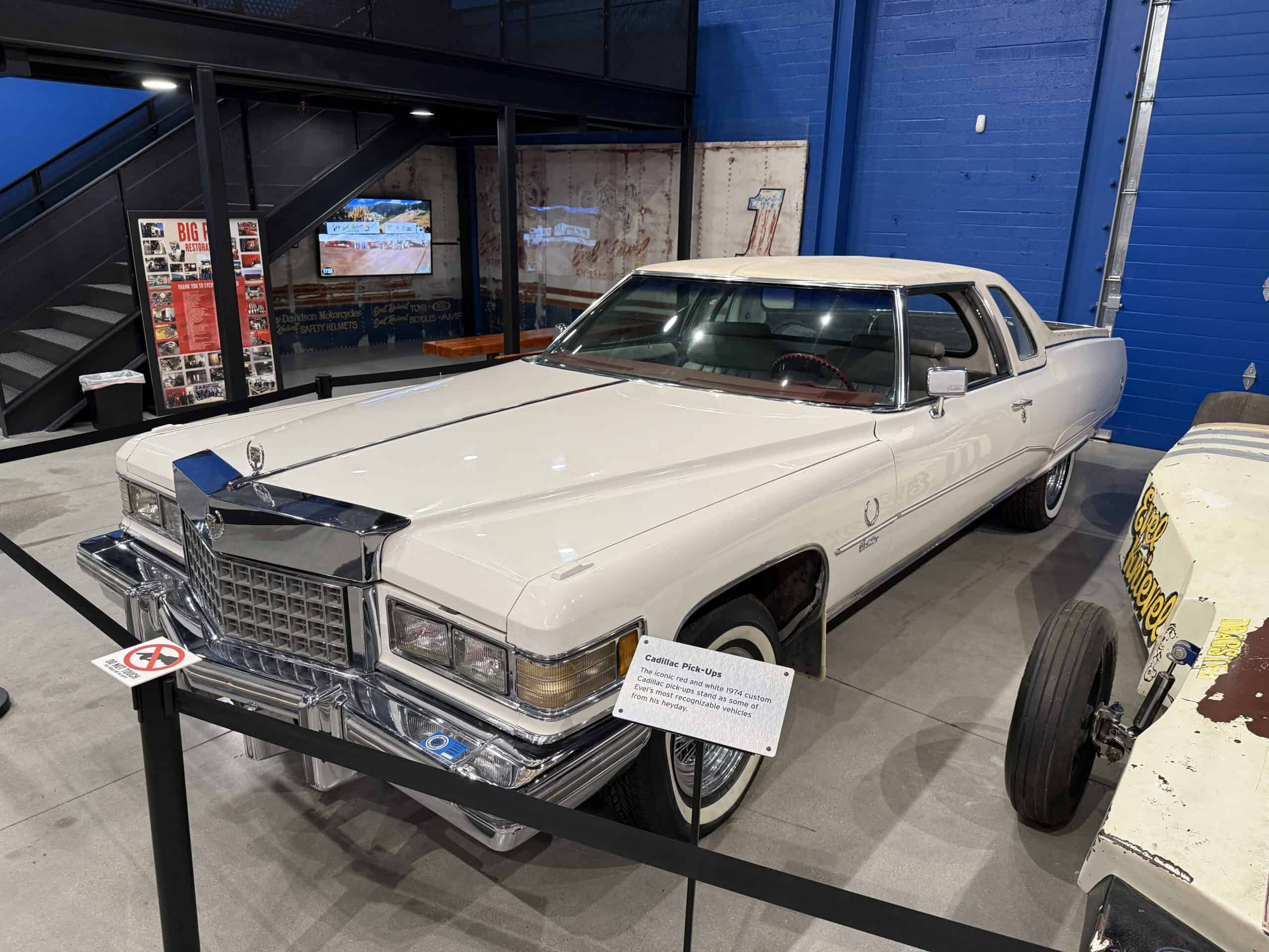 A white Cadillac Car pick up.