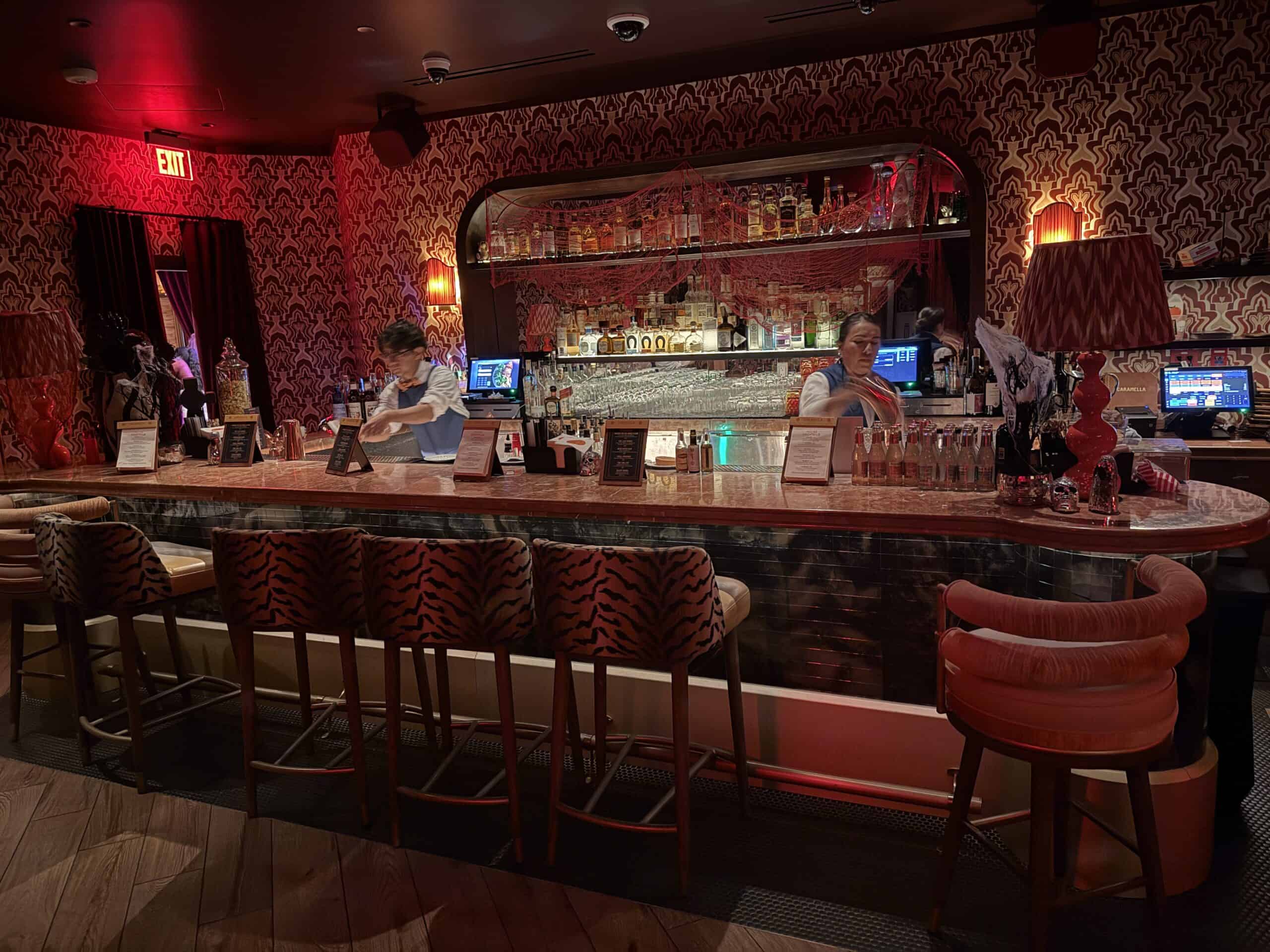 The Bar in Caramella's Hidden Lounge, with illuminated bottles.