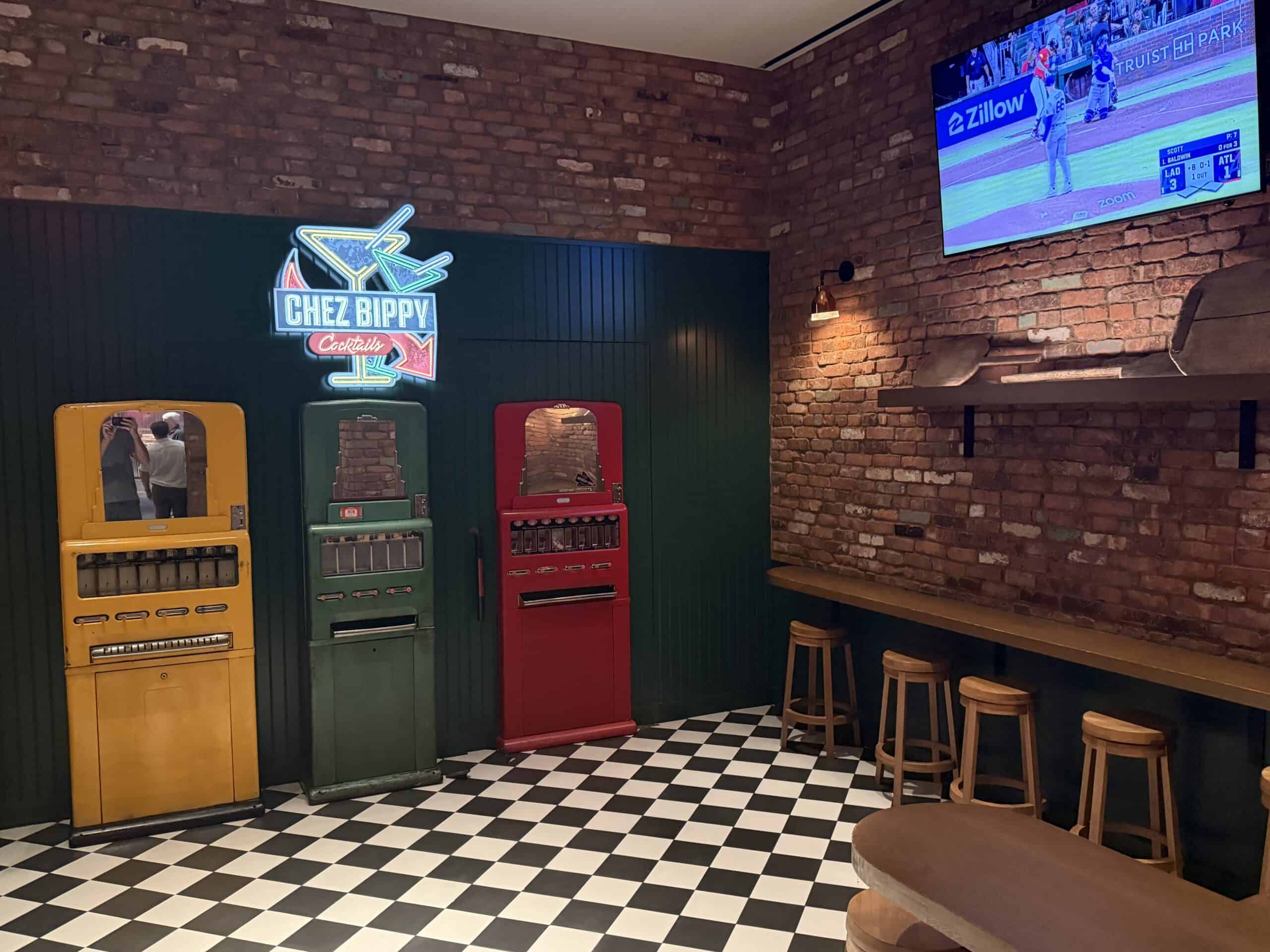 The entrance to Chez Bippy, which is a red soda machine on a wall, which doubles as the secret door.