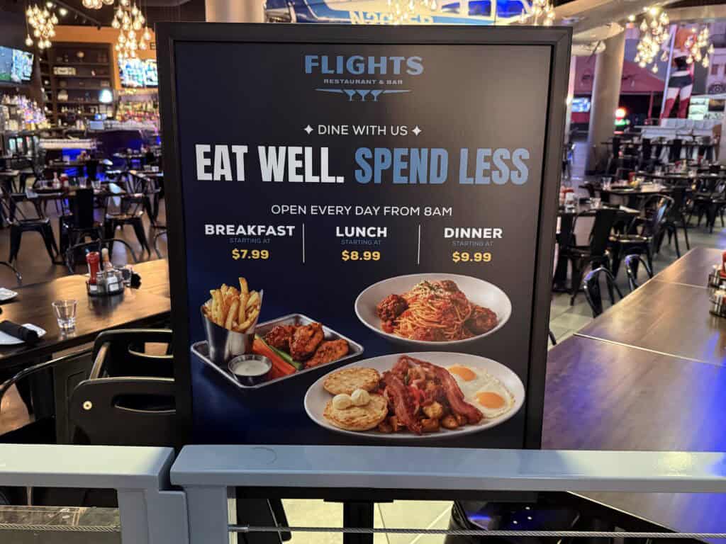 A sign adversising food deals at Flights.