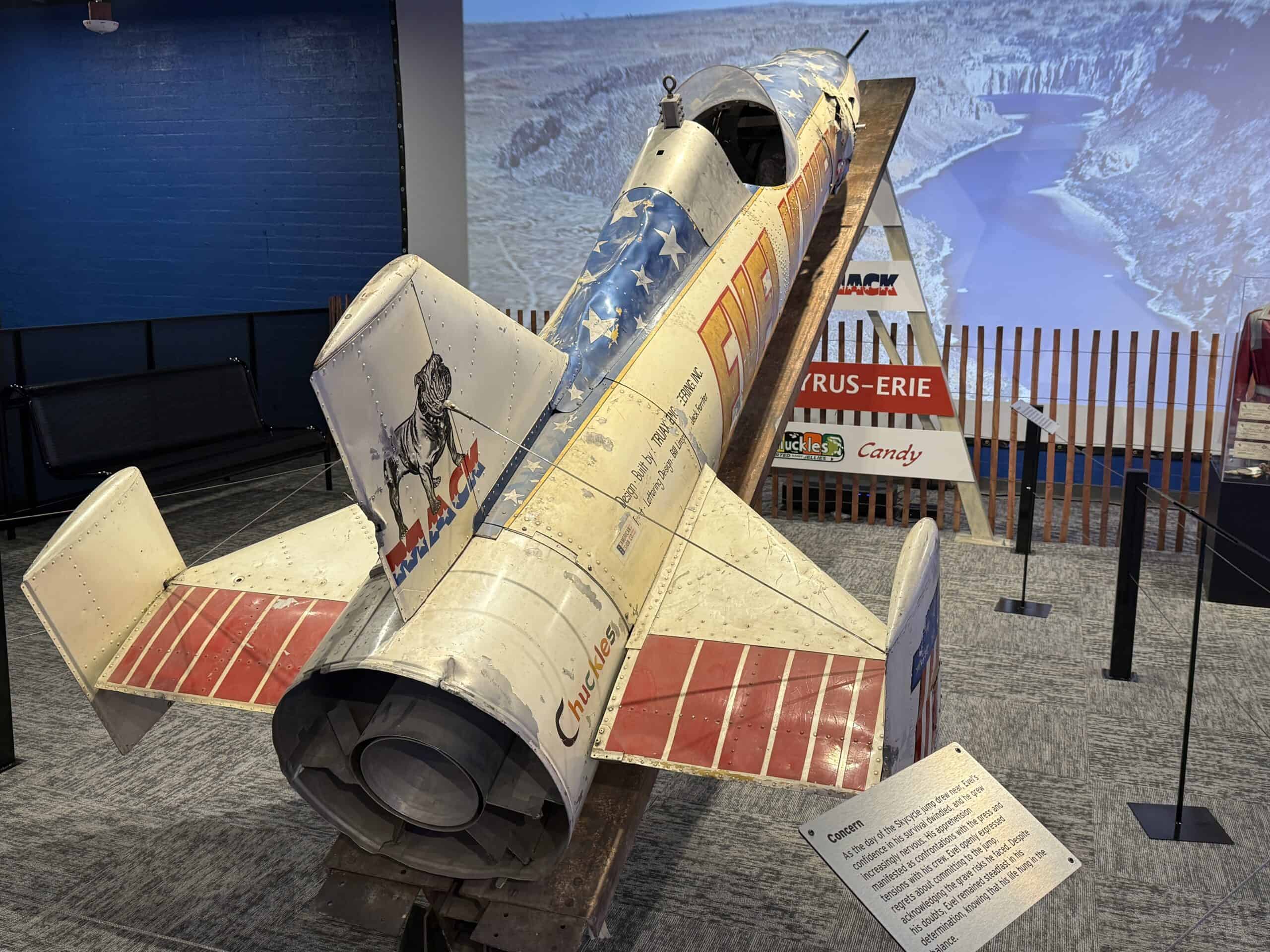 A skycycle pointed at a screen depicting the canyon he jumped.