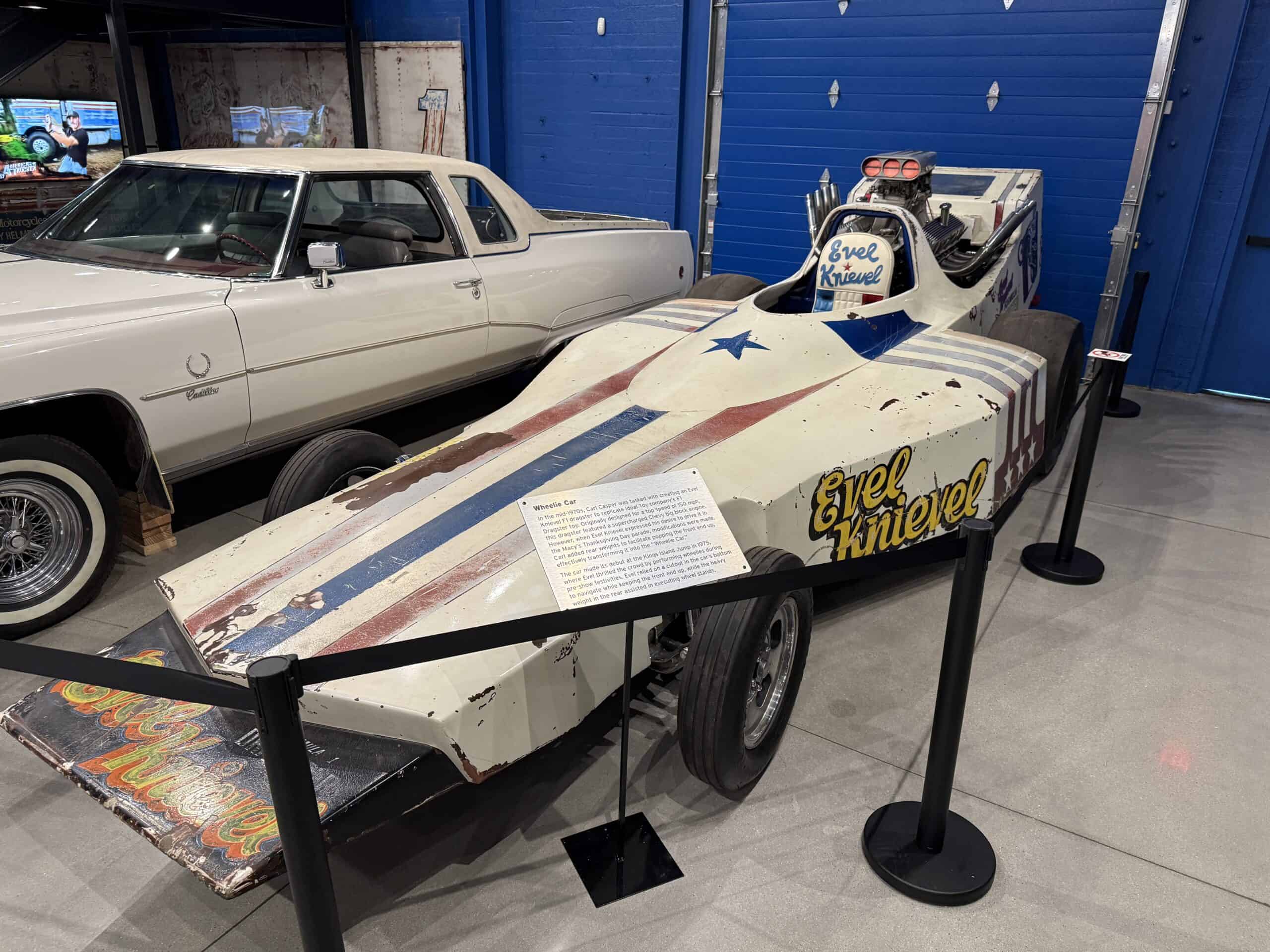 A red, white and blue wheelie car.