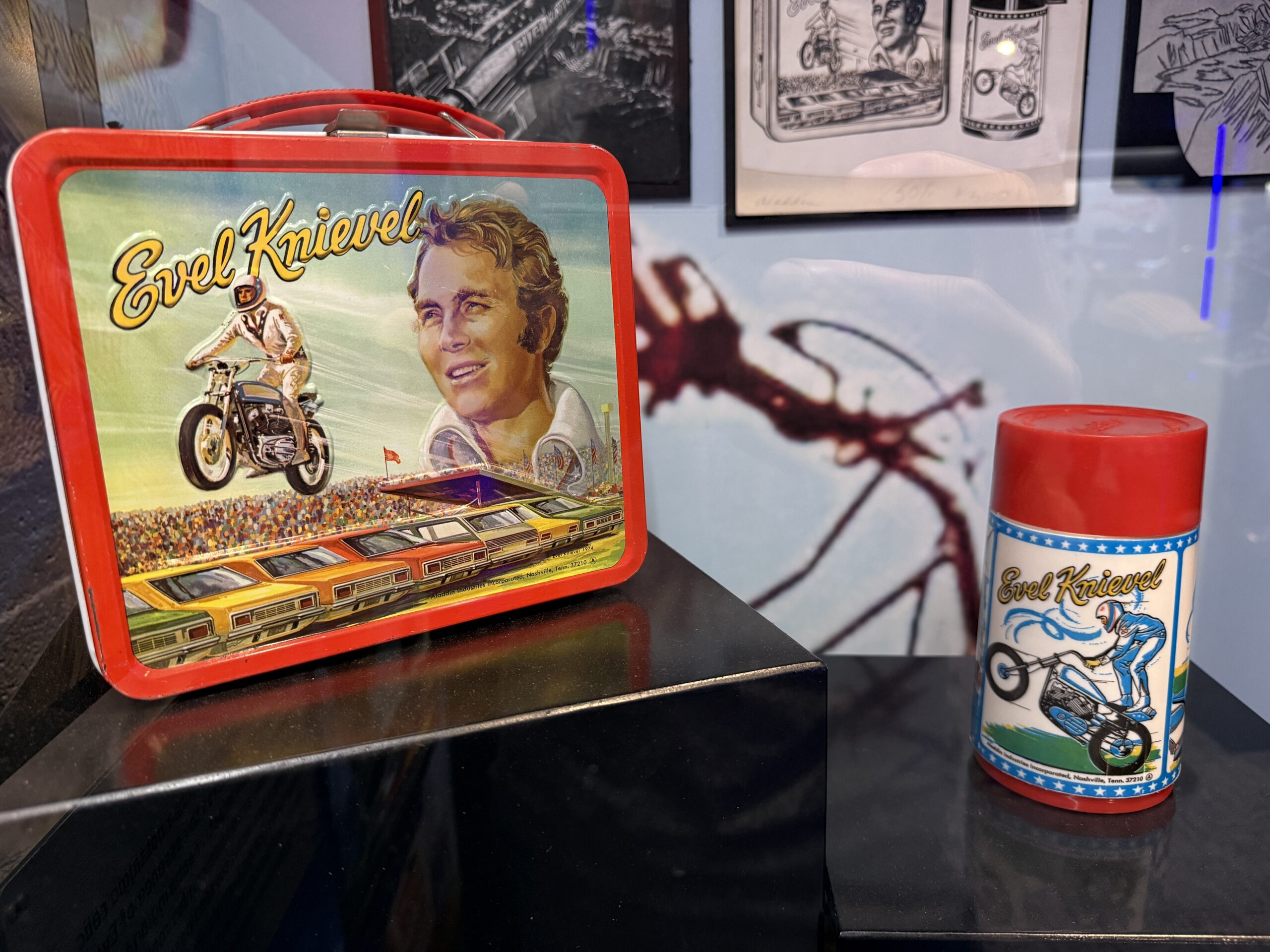 An Evel branded lunch box and thermos set.