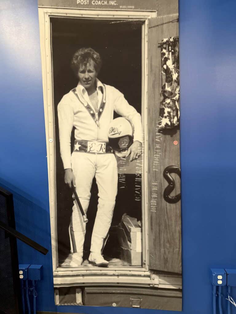 Evel, standing in the doorway of Big Red.