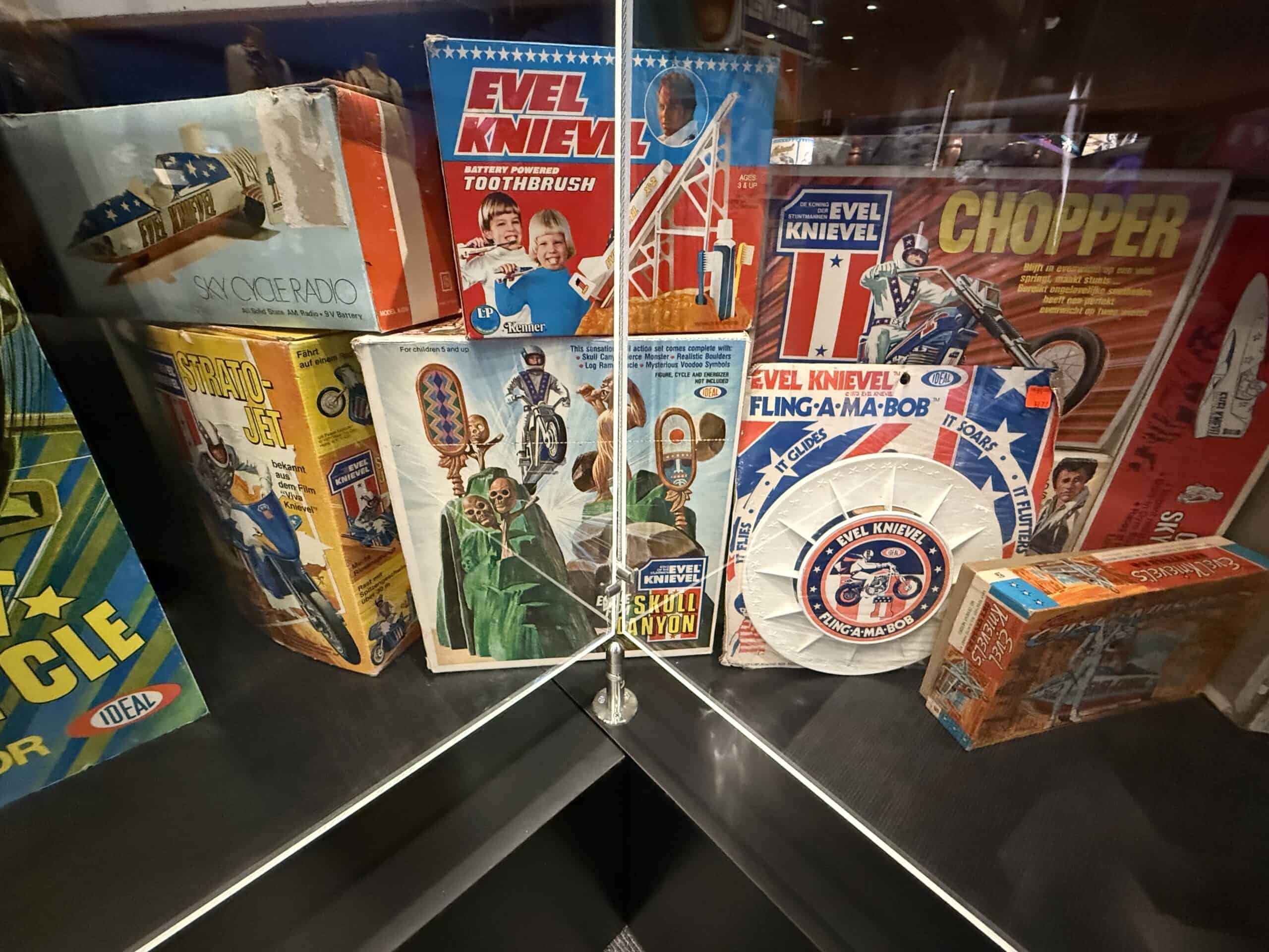 Evel Knievel themed board games and toys on display.