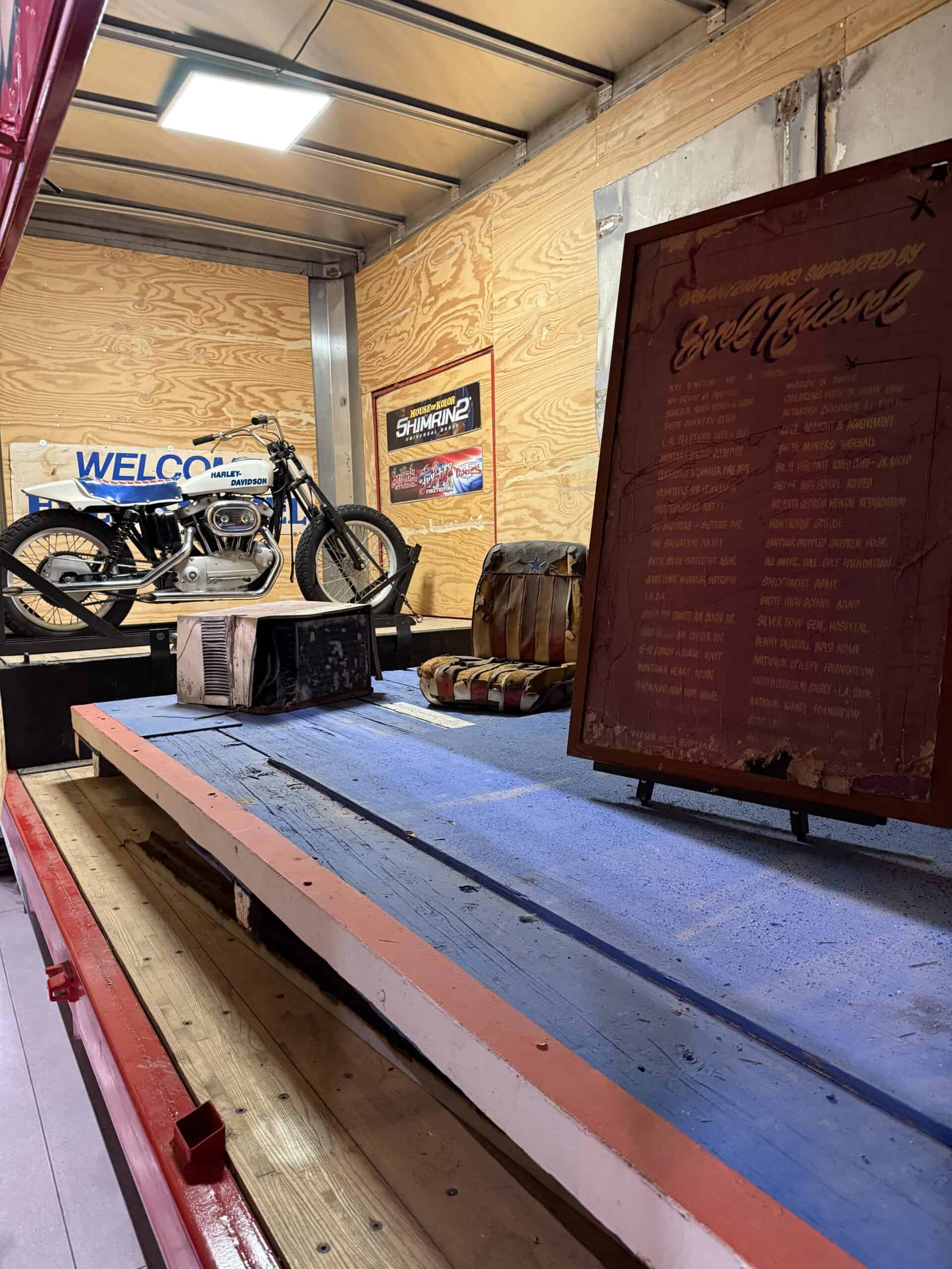 A look inside Big Red's trailer, which is hauling a bike and ramps.