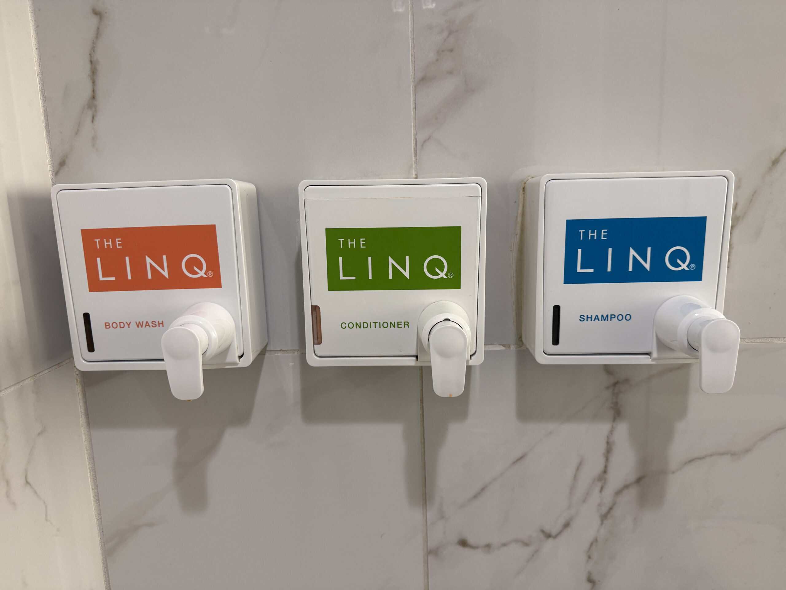 Wall mounted pumps in the shower for body wash, shampoo, and conditioner.