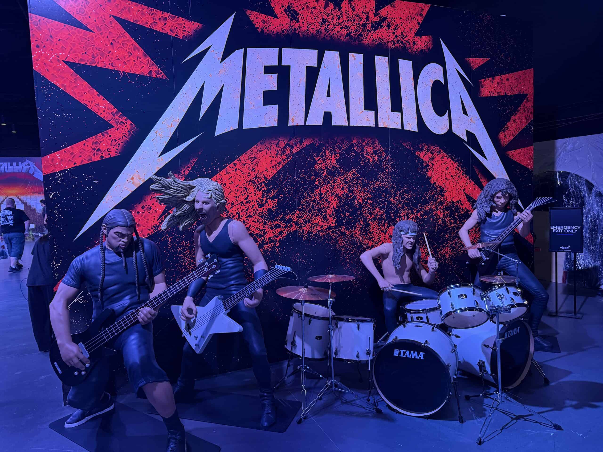 Wax figures of Metallica, simulating them on stage.