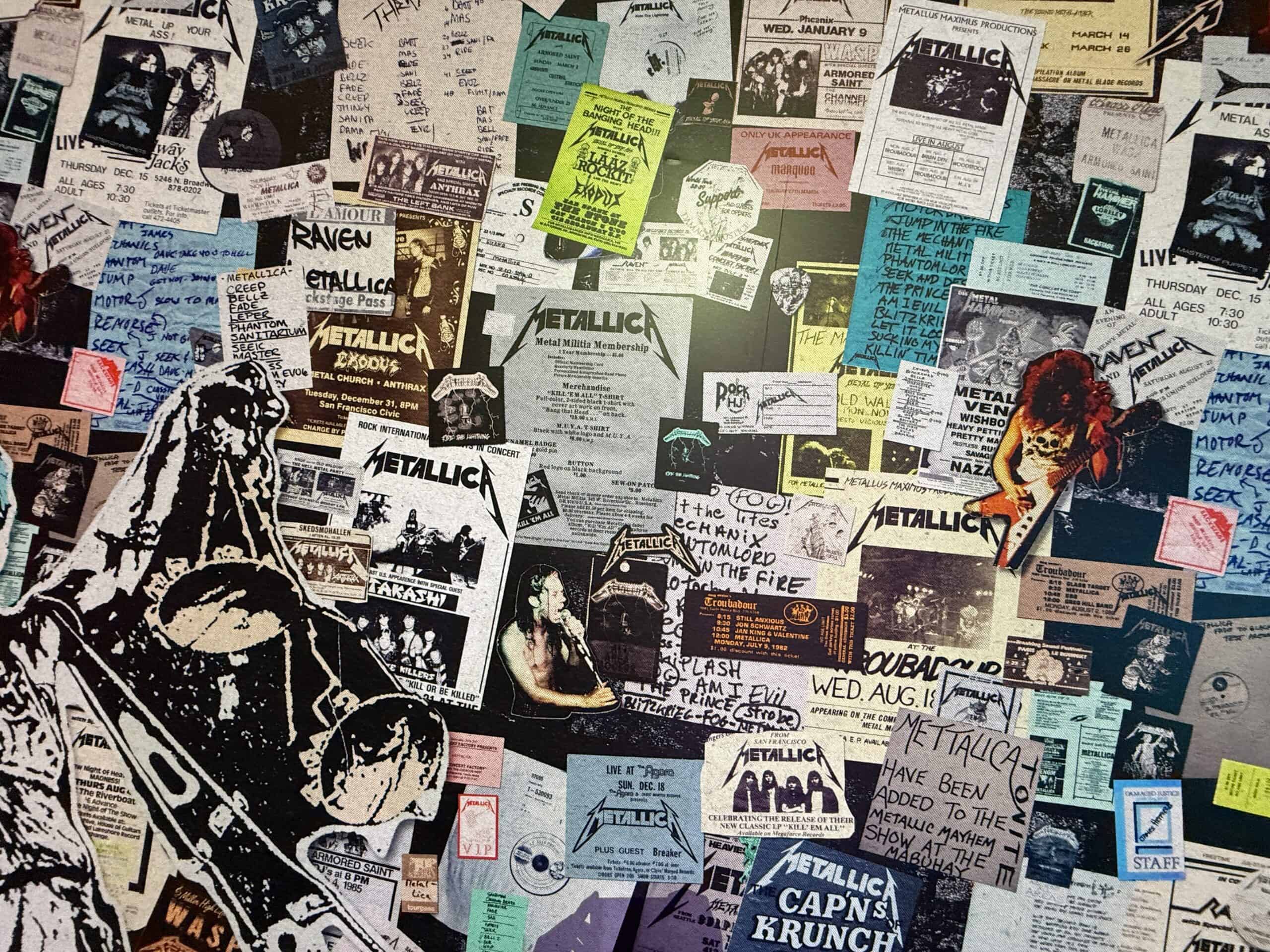 A wall covered in Metallica concert posters and other written memrobelia.
