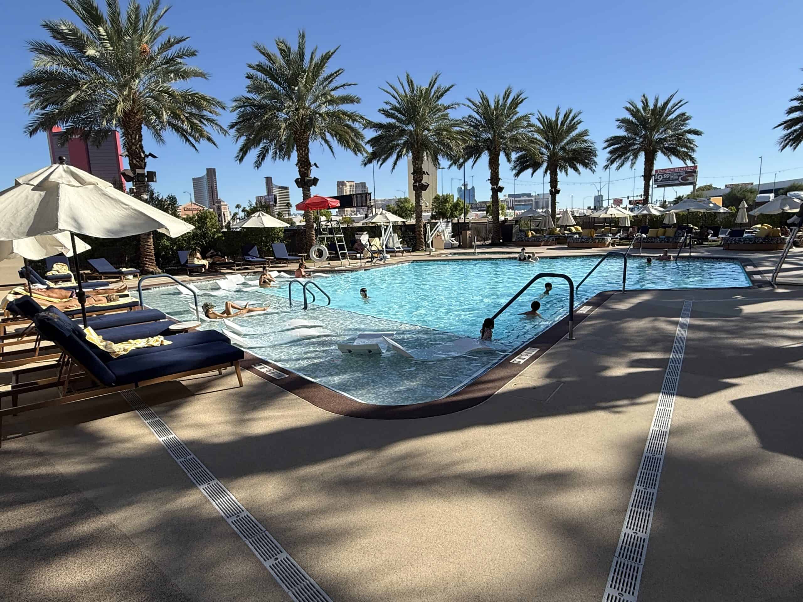 The pool at Palace Station with a row of palm trees in the background.