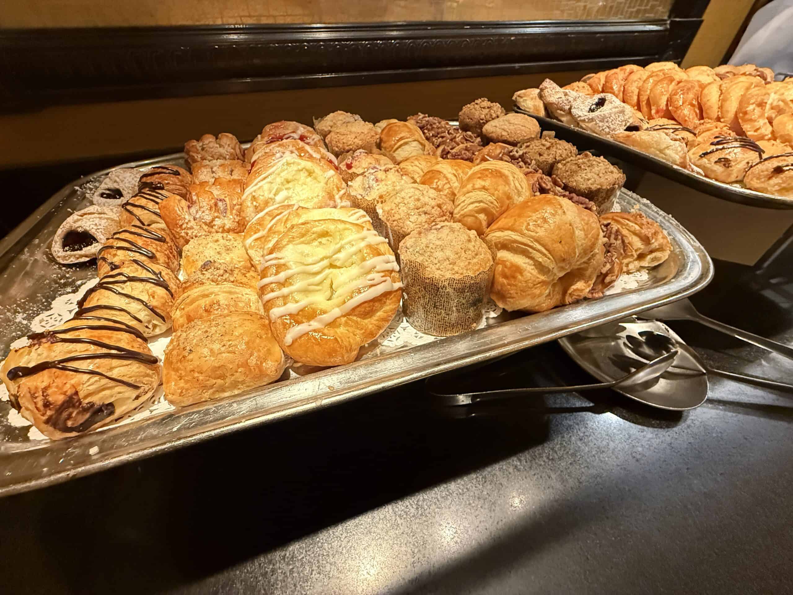 Assorted breakfast pastries on a tray.