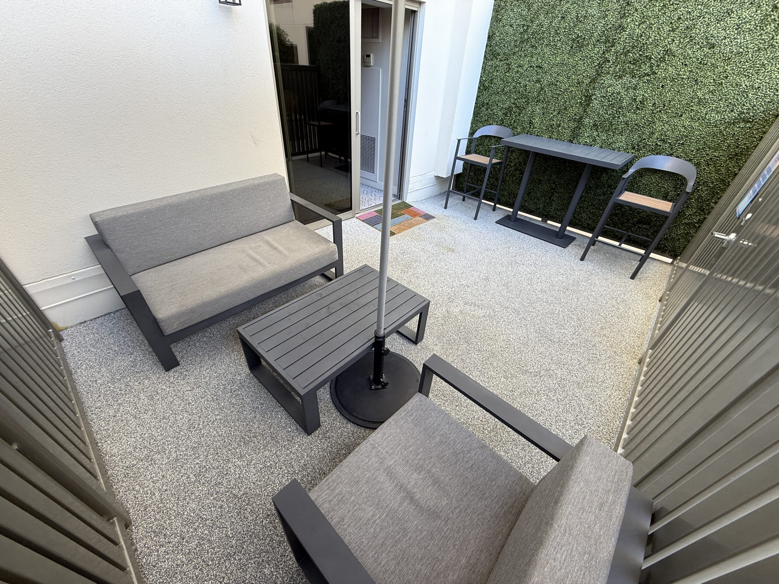 A close up of the seating under the umbrella, which has thick padding.