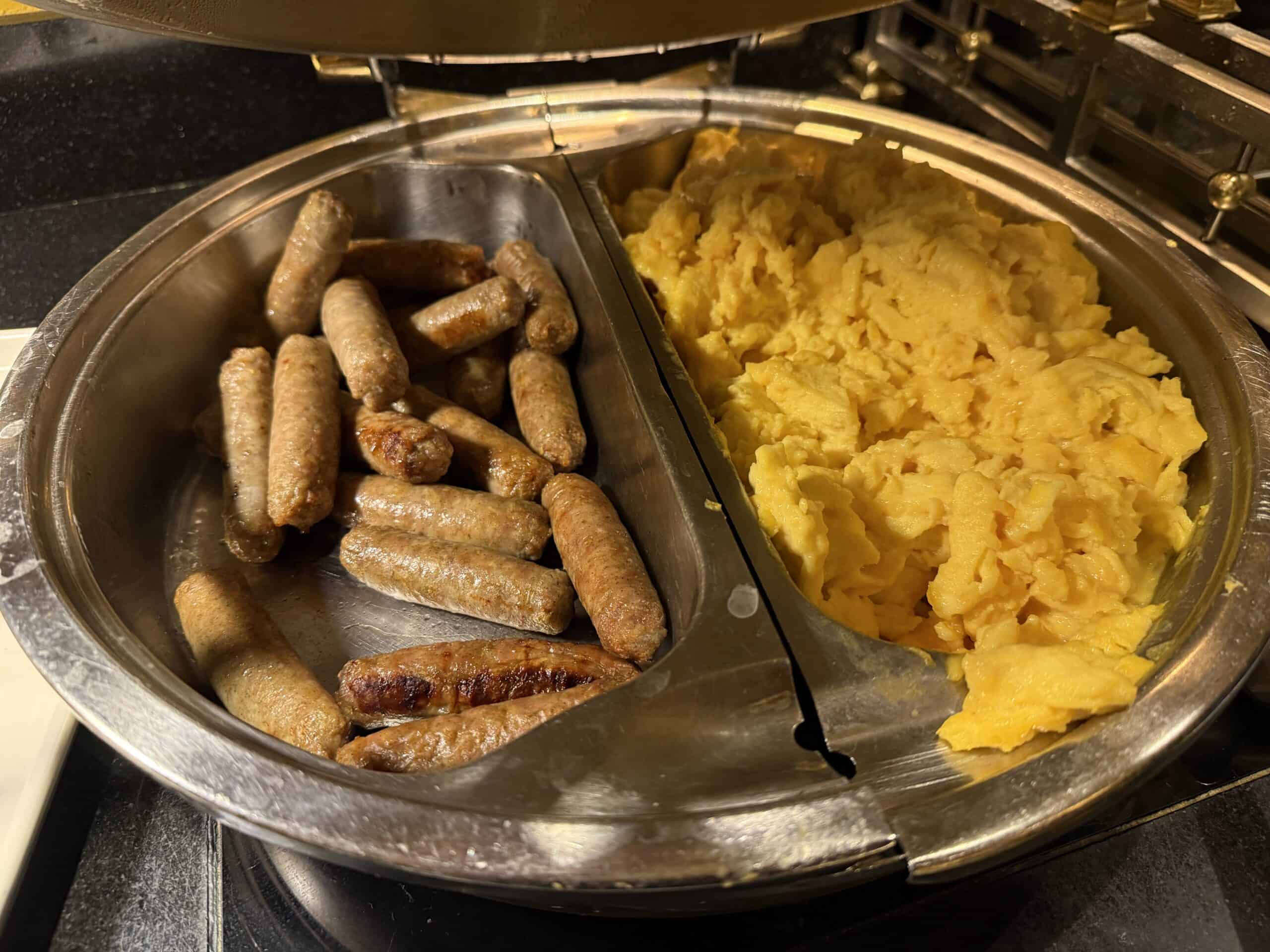 Sausage links and scrambled eggs in the buffet.