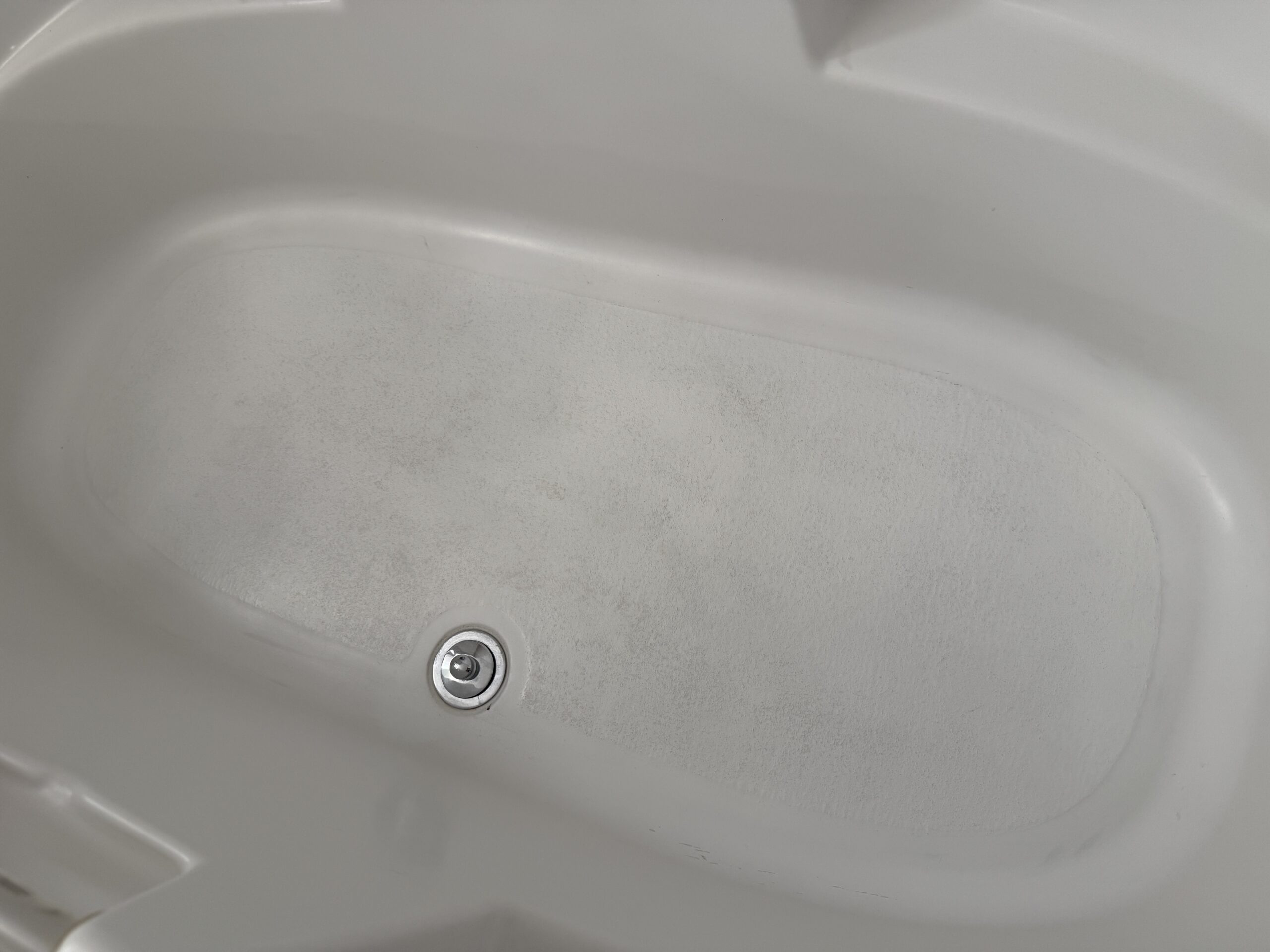 A darker than average tub floor.